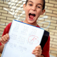 Young boy showing his good qualifications.