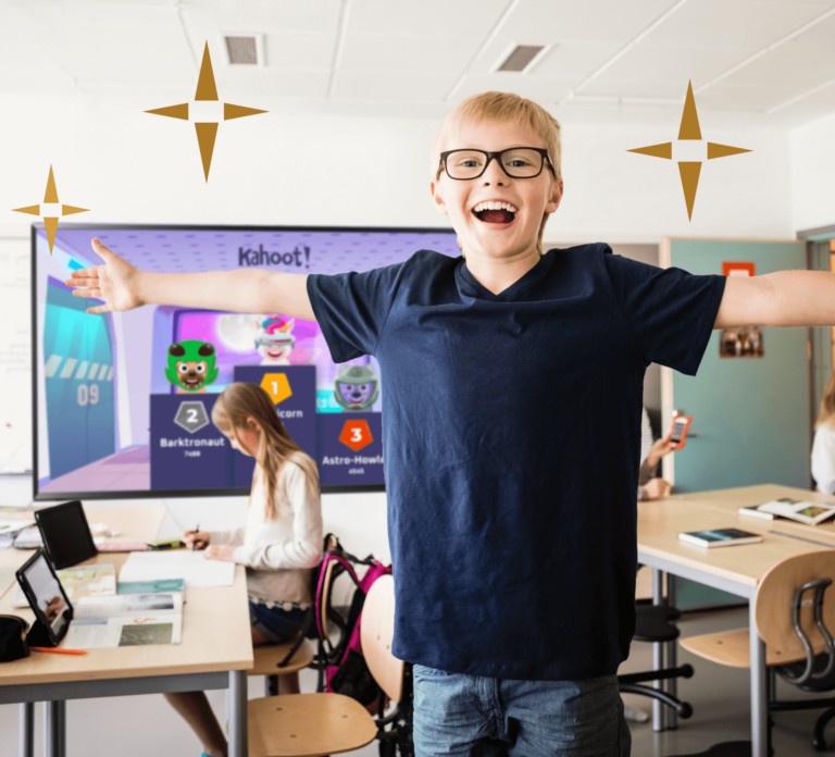 Close up of a child celebrating in a classroom in front of a kahoot podium