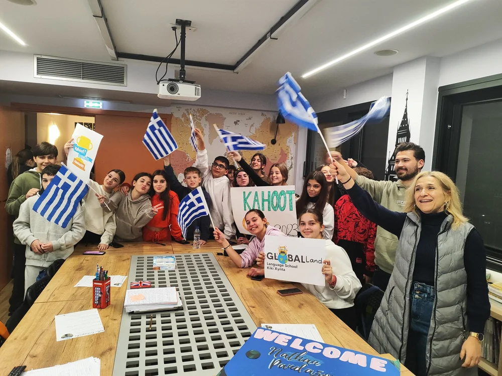 Students in Greece celebrating by waving flags