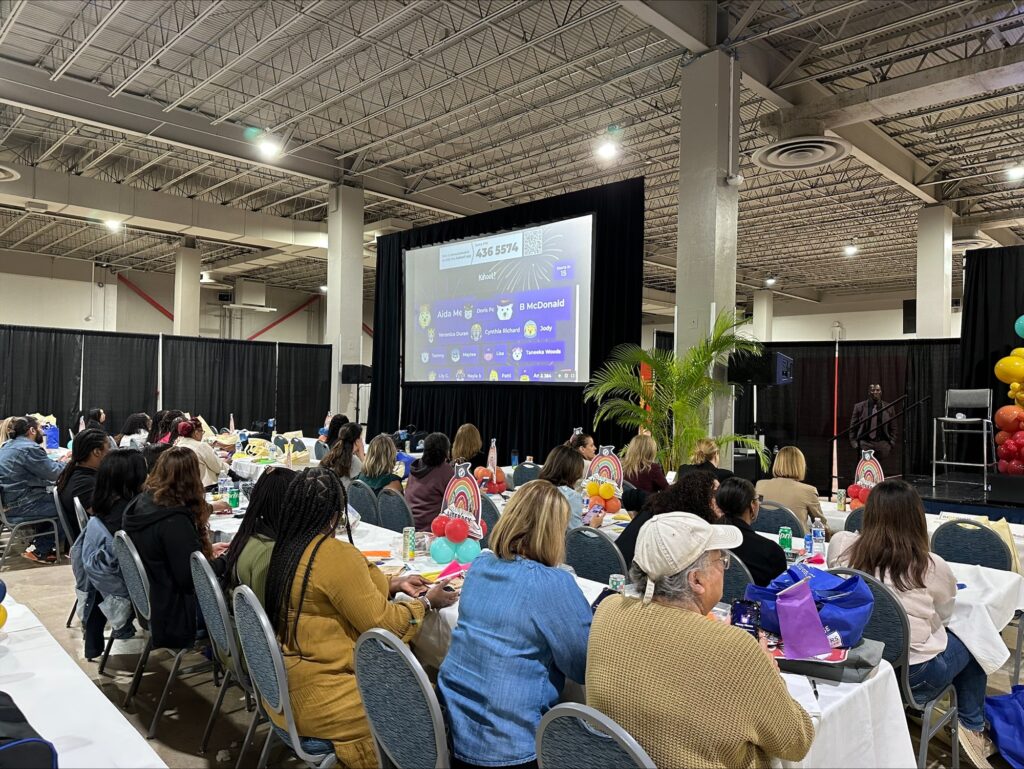 Teachers gathering to play a live kahoot at a conference