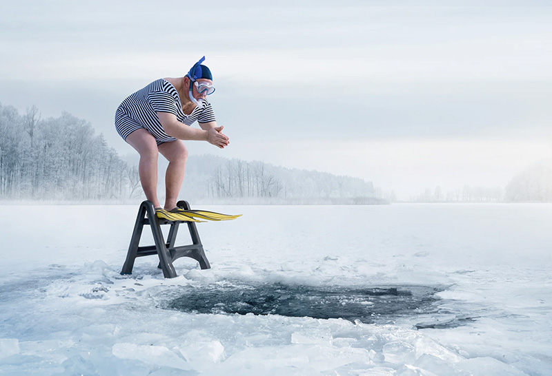 man jumping into ice water