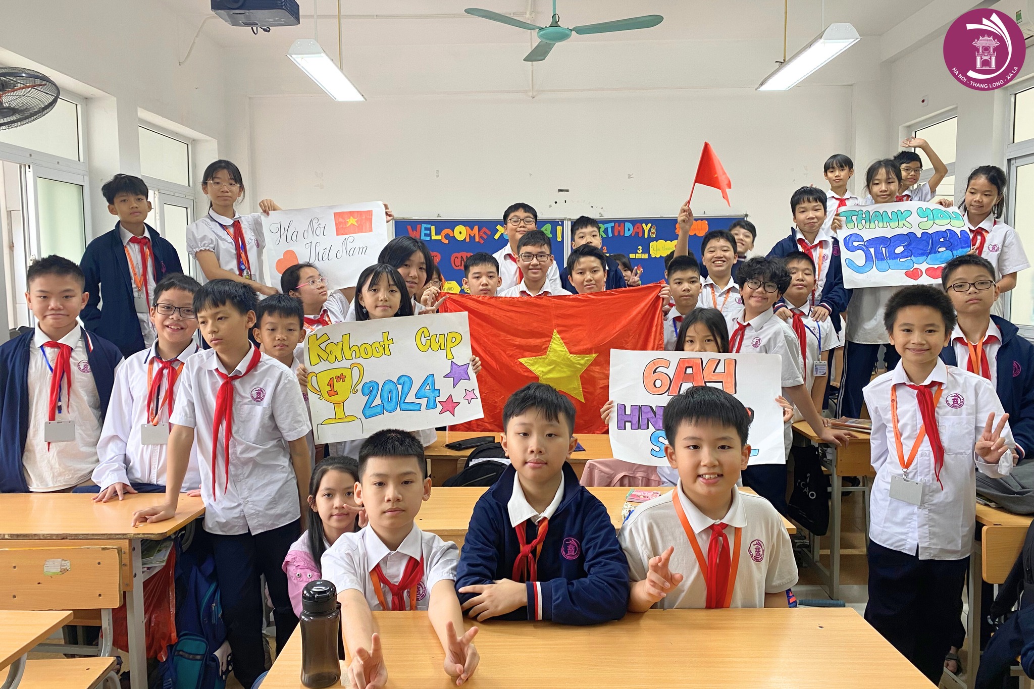 students posing with Vietnam flag with posters for Kahoot Cup