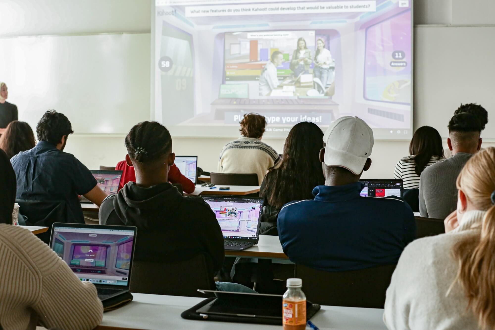 Higher ed students playing Kahoot! in a classroom