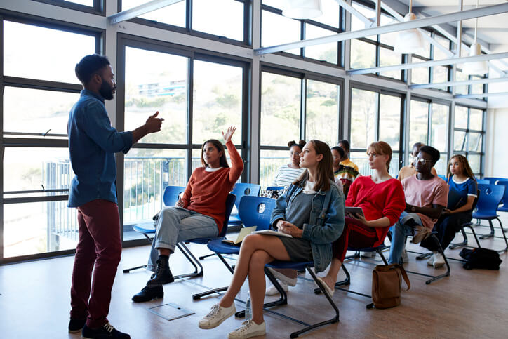 Professional speaking before a group of young colleagues