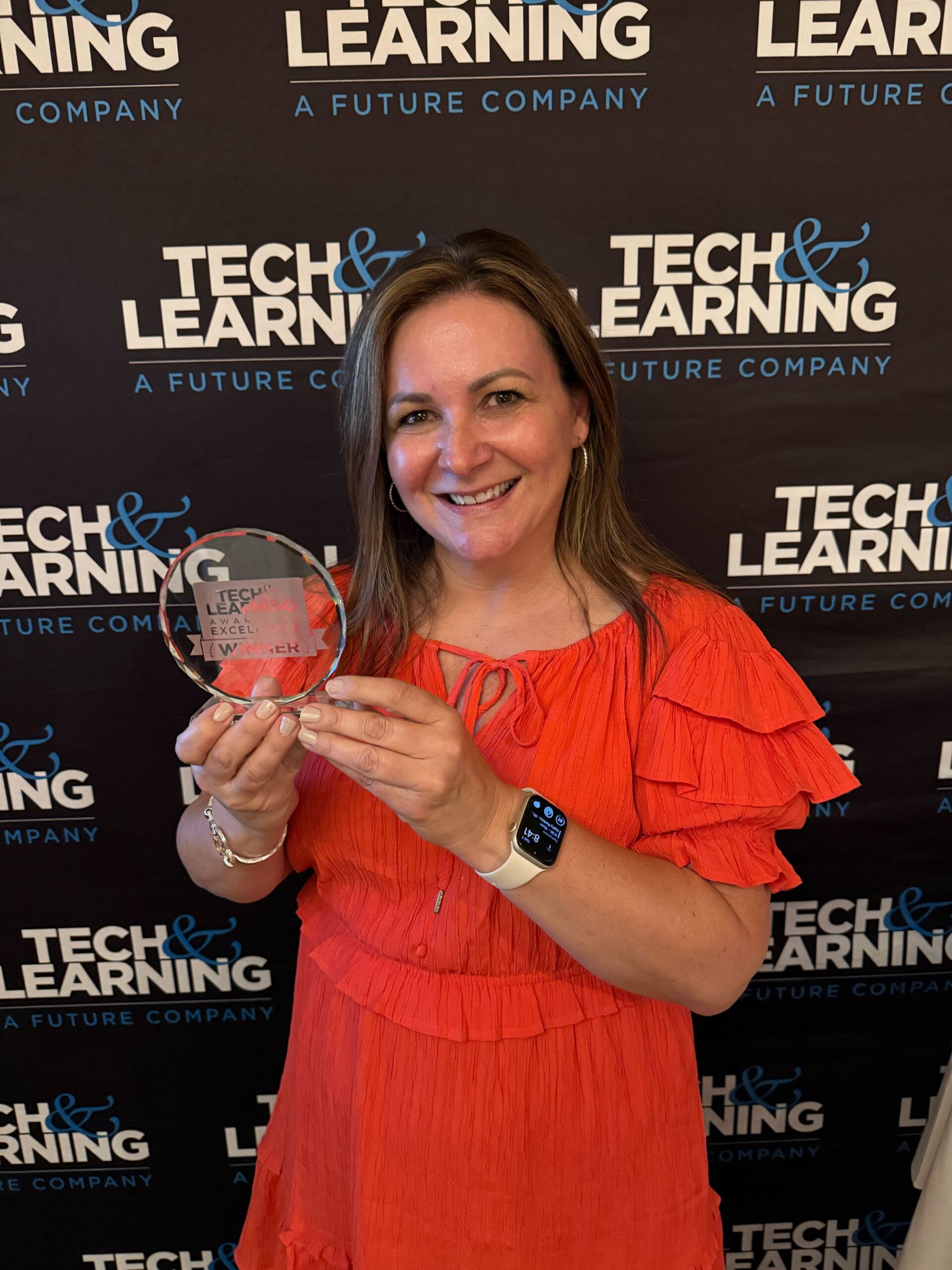 Liz Crawford, Director of U.S. Education at Kahoot!, holding a Tech & Learning Award