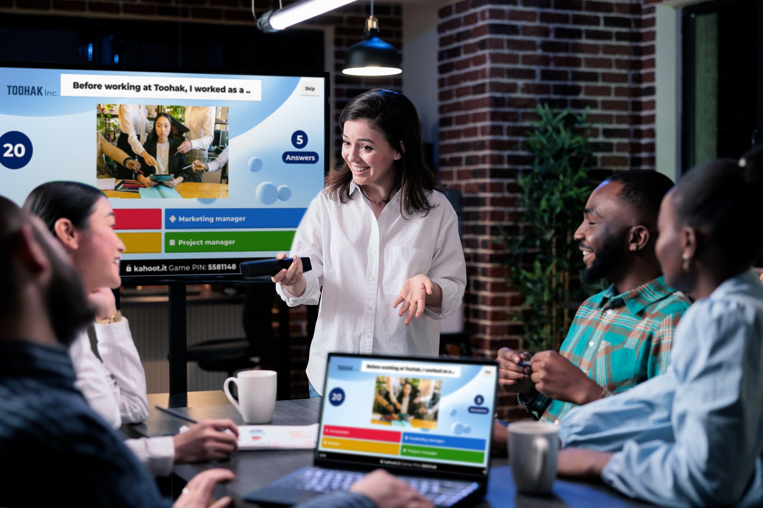 Female presenter conducting training to small group of employees