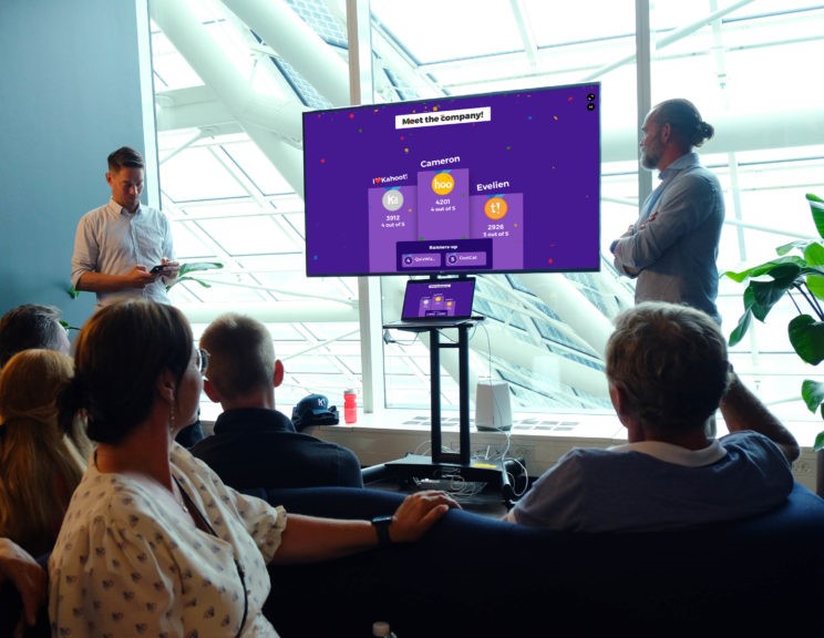 Two professionals delivering a presentation for employees with Kahoot!