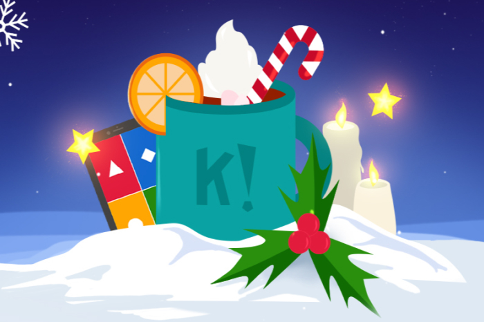Animated winter scene with a teal mug of hot chocolate topped with a candy cane and whipped cream, surrounded by holly, lit candles, and a smartphone displaying the Kahoot! colors.