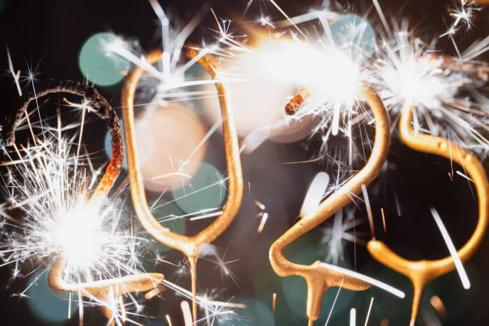 Close-up of sparklers shaped like the numbers 