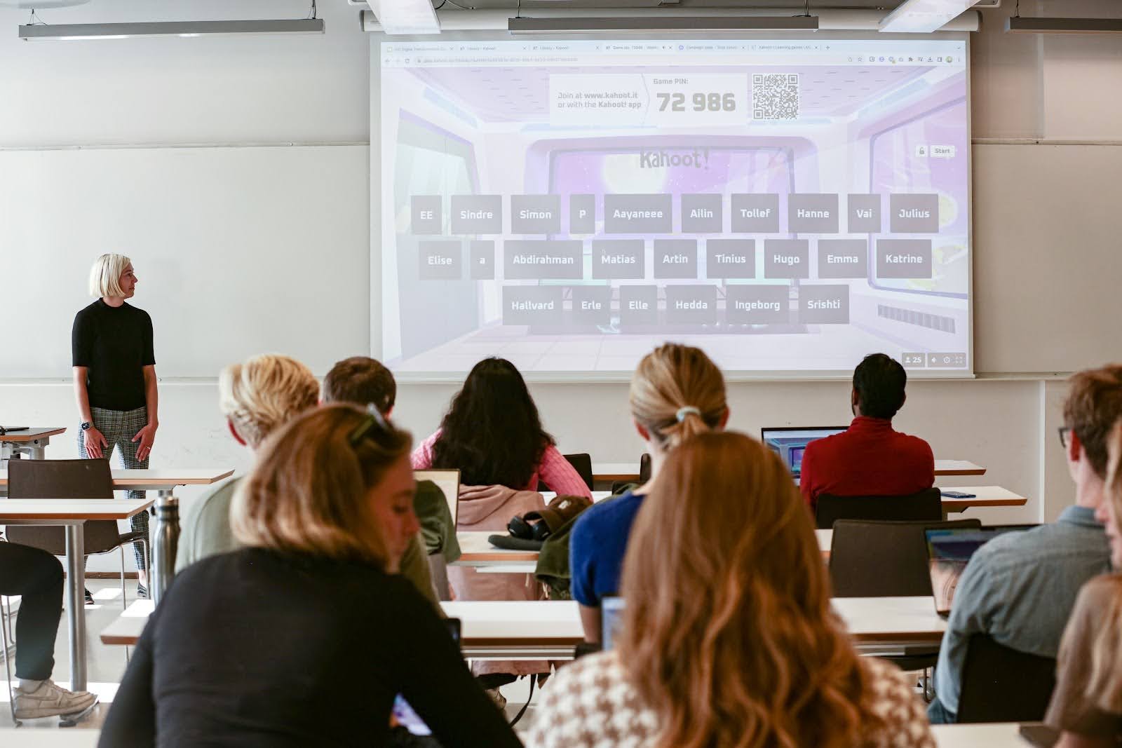 Higher ed students play a kahoot session in a classroom