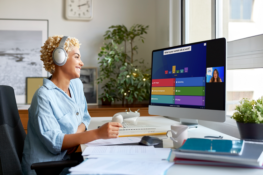 A professional participating in a kahoot during a hybrid meeting