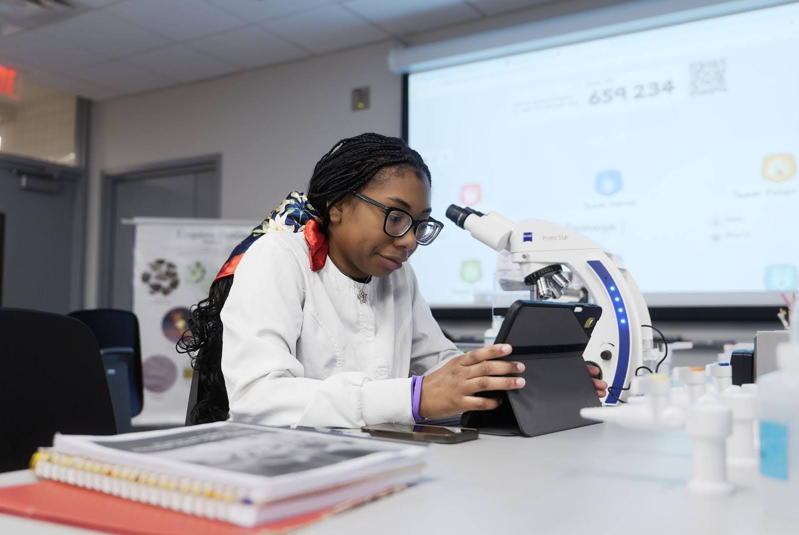 Student working on a tablet in a classroom