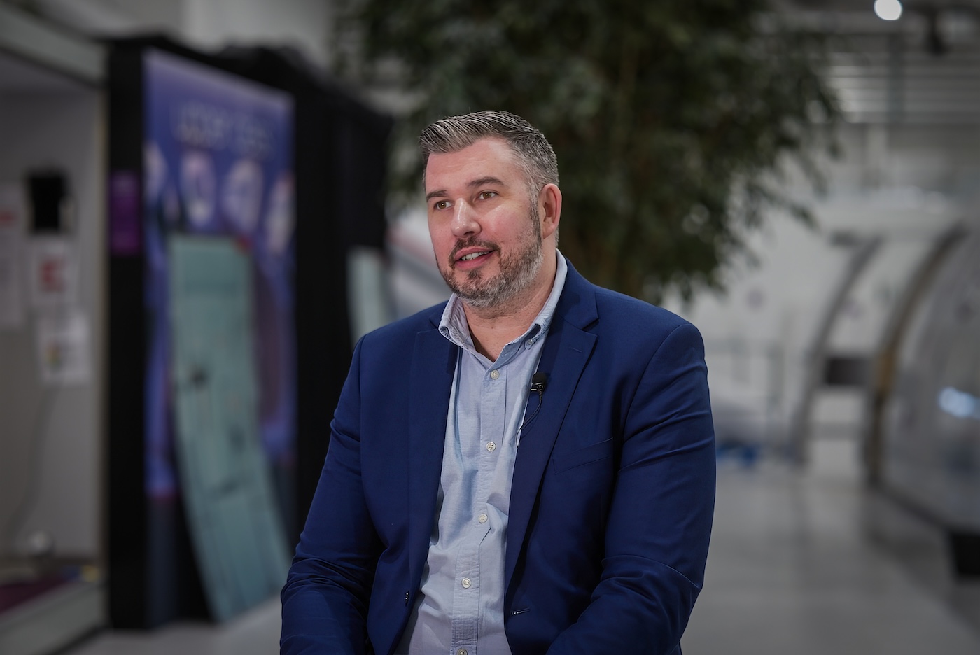 Man in a blue jacket, his name is Chris Short.