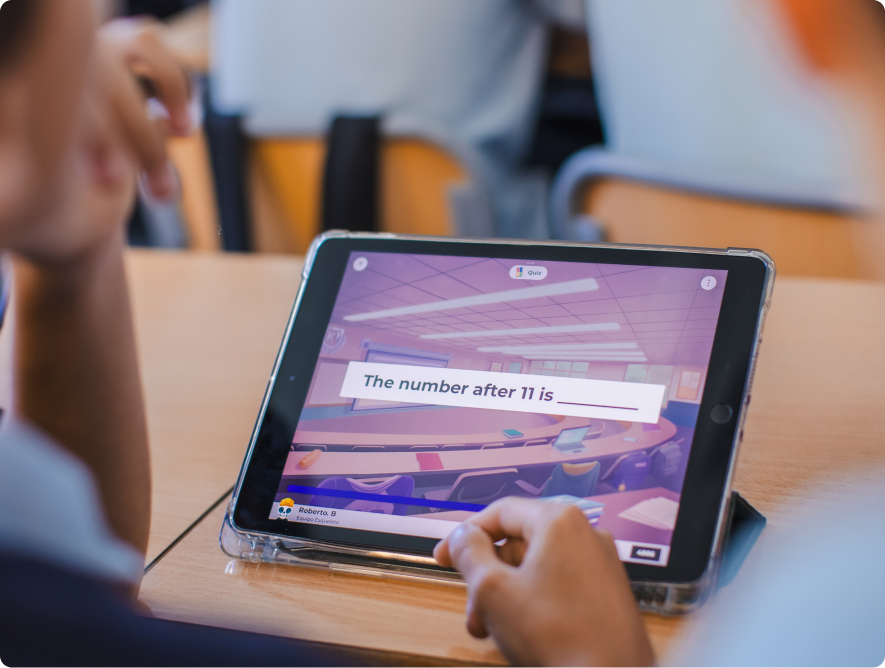 Tablet screen showing a Kahoot fill-in-the-blank question reading 